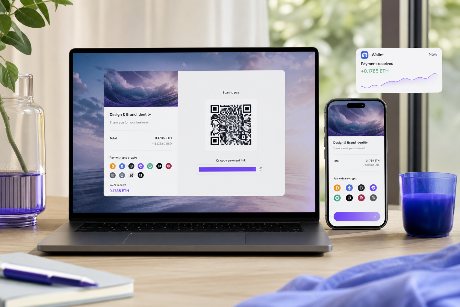 Side-by-side device shot — a laptop screen displaying a payment link with custom branding, a phone alongside showing the same link's mobile checkout view, with a small wallet balance notification visible. Clean desk, daylight, no logos faked.