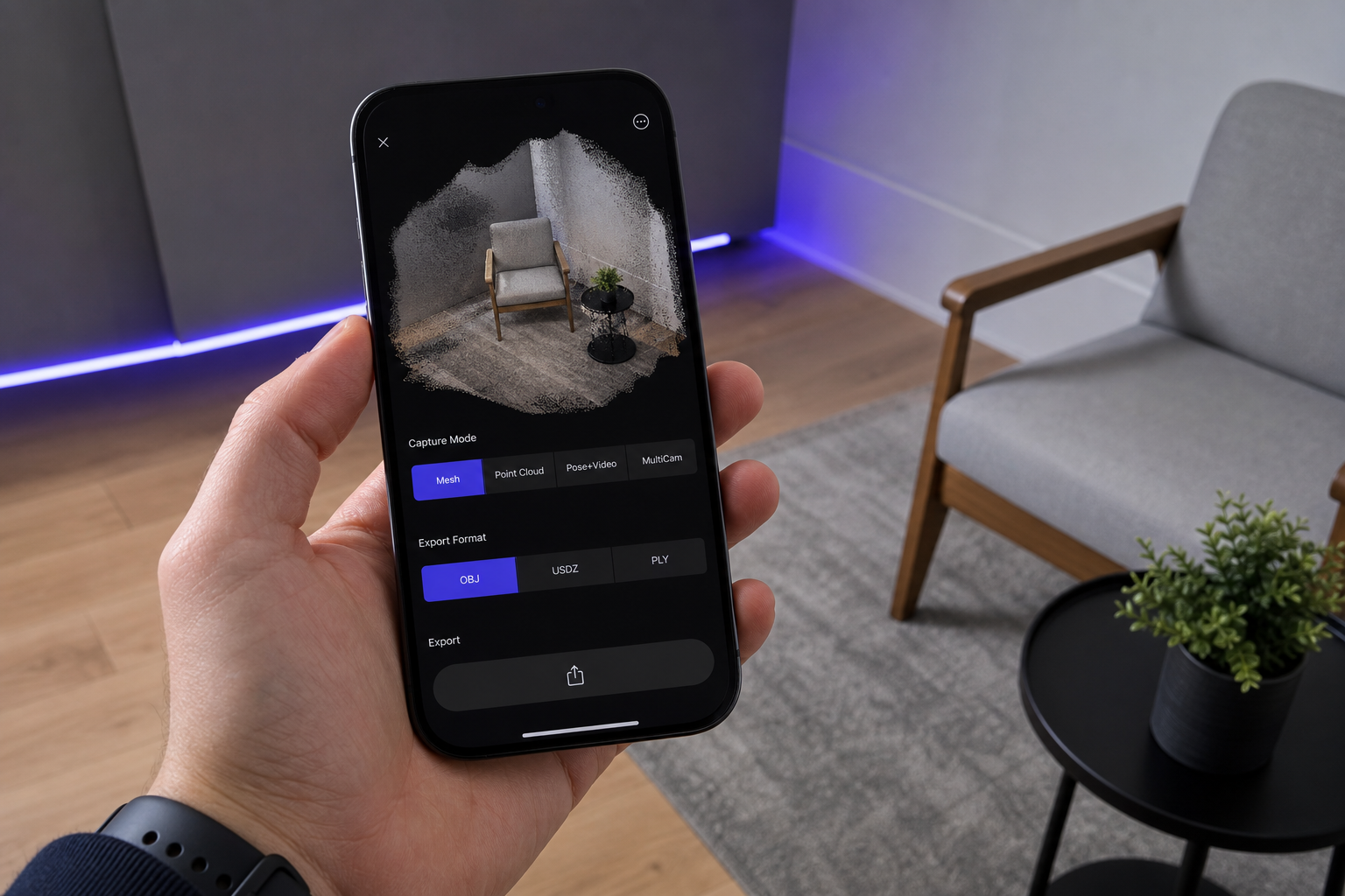 iPhone 12 Pro or later held in hand showing the Voxelio export panel. The screen shows the capture mode selector (Mesh / Point Cloud / Pose+Video / MultiCam) and export format options (OBJ, USDZ, PLY) clearly visible. Real UI, not a mockup. Shot from